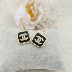 Black and crystal studded earrings