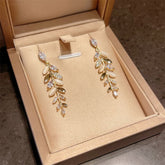 EUR420 Crystals leaves long earrings in Ivory