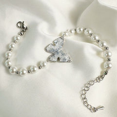 EUR453 Vivid Butterfly and Pearl Mix Bracelet in Pale Blue
